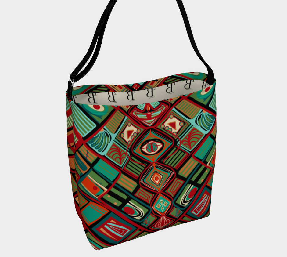 Colorful patterned bag with a black strap on a light gray background