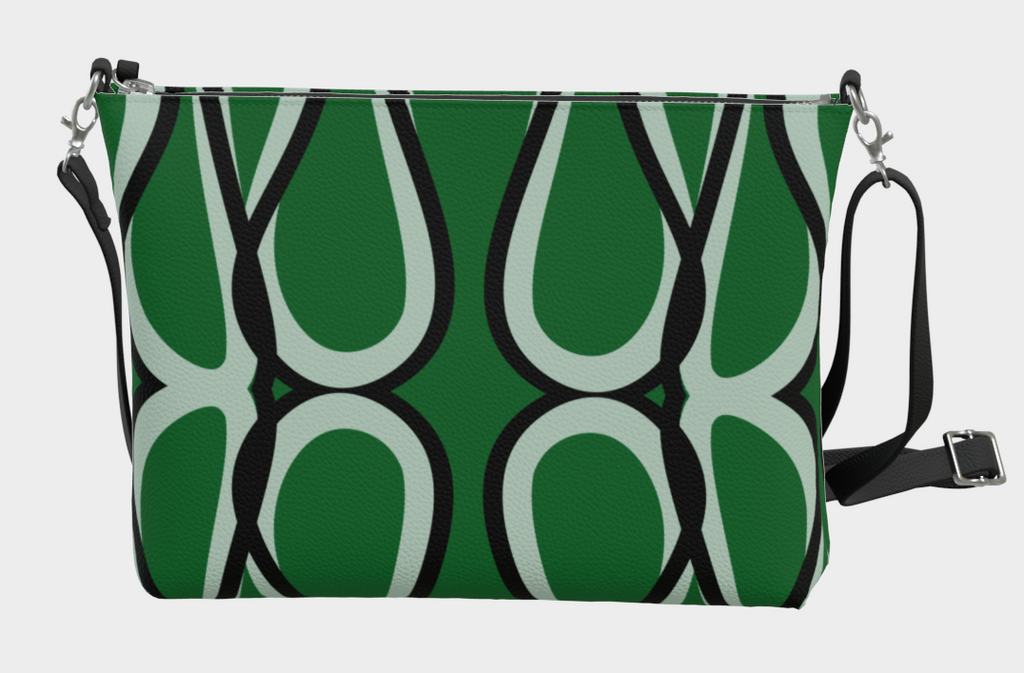 Green handbag with black and white pattern on a light gray background