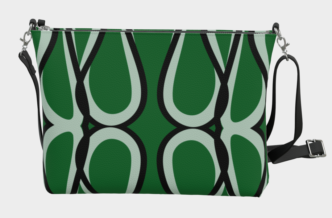 Green handbag with black and white pattern on a light gray background