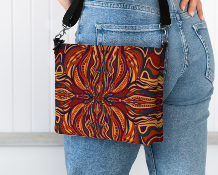 Person holding a patterned bag with a plain background