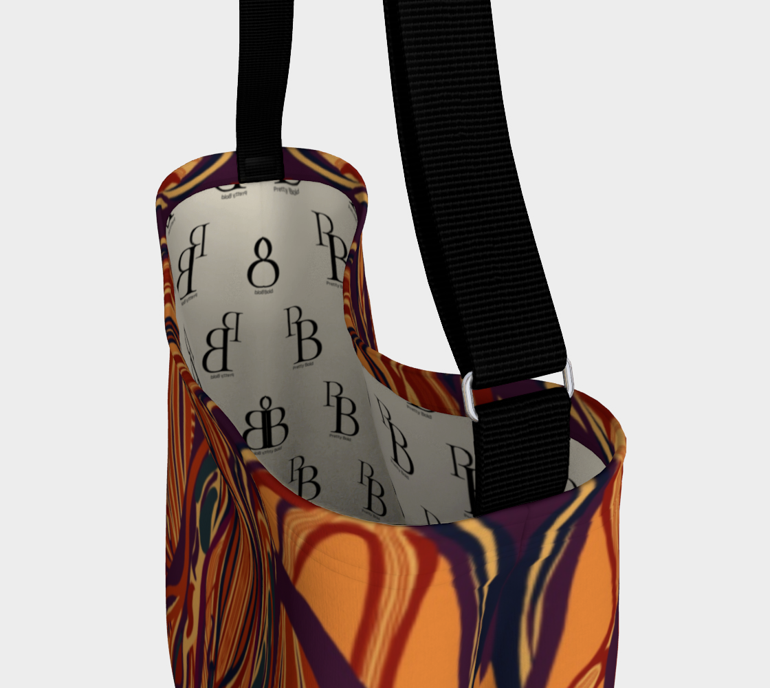 Colorful bag with a patterned strap on a light gray background