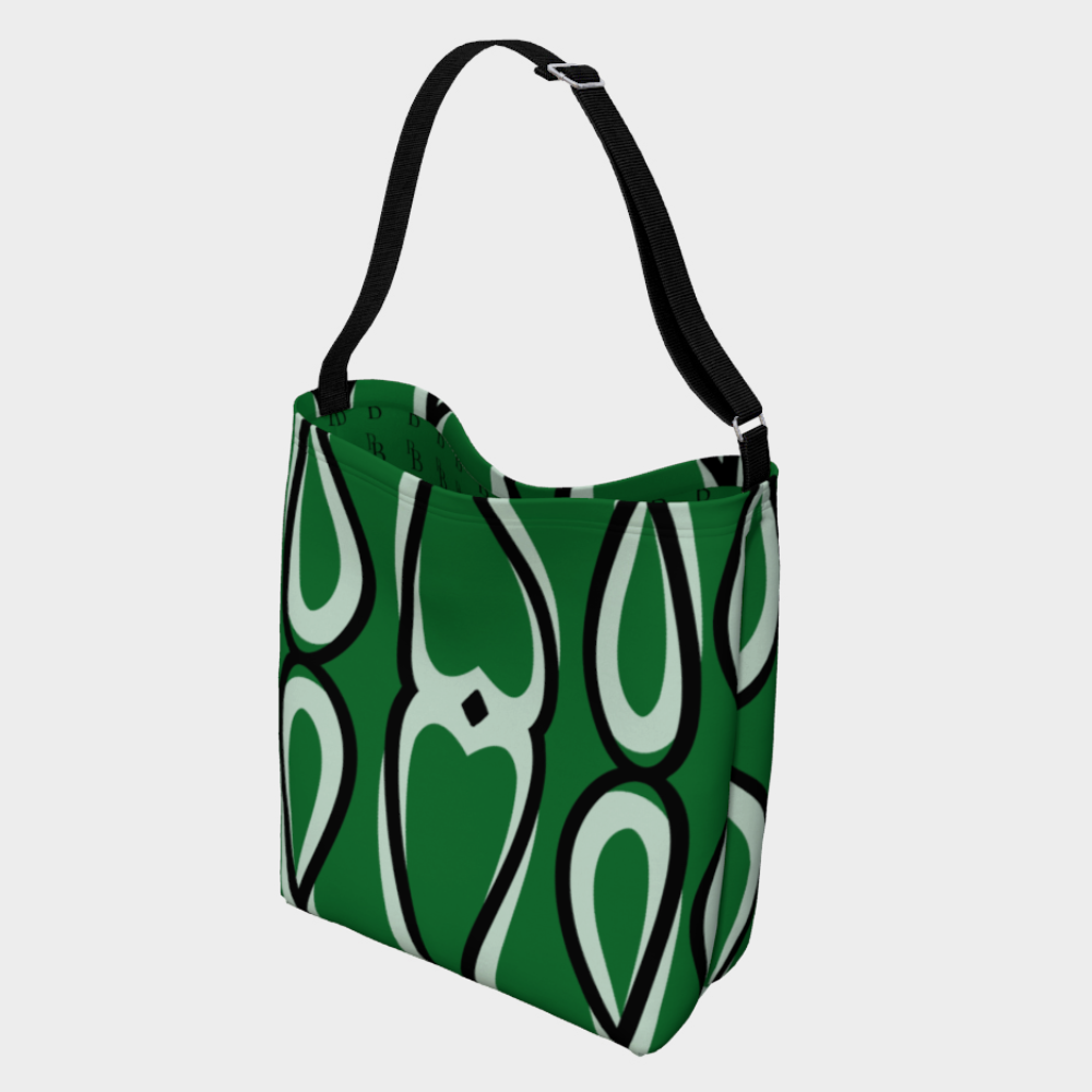 Green tote bag with white and black abstract pattern on a light gray background