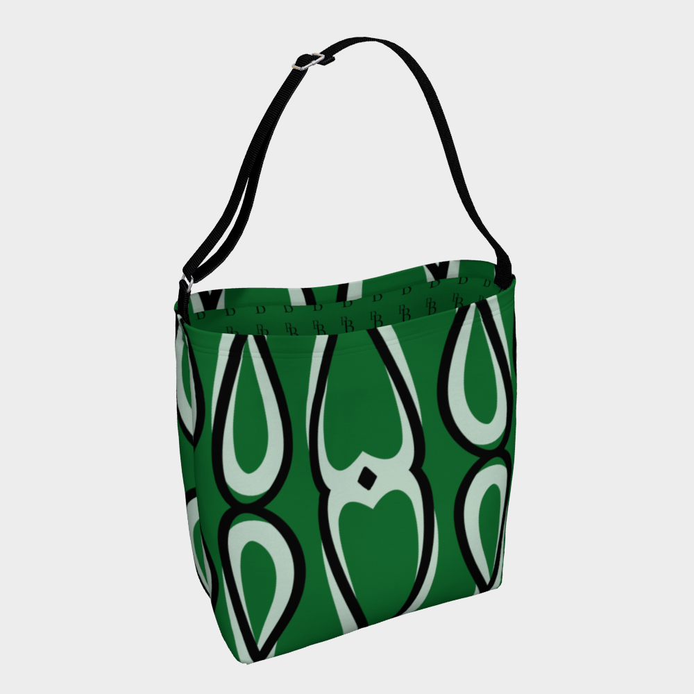 Green tote bag with white abstract patterns on a light gray background