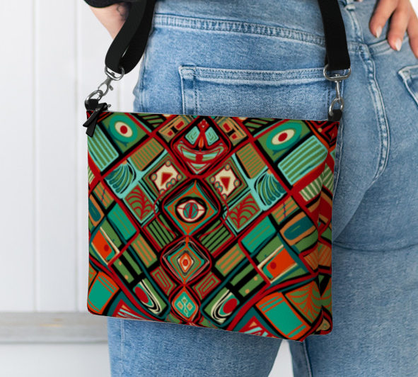 Person holding a colorful patterned bag against a white background