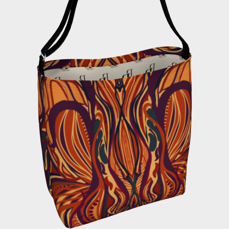Colorful patterned bag with a black strap on a white background