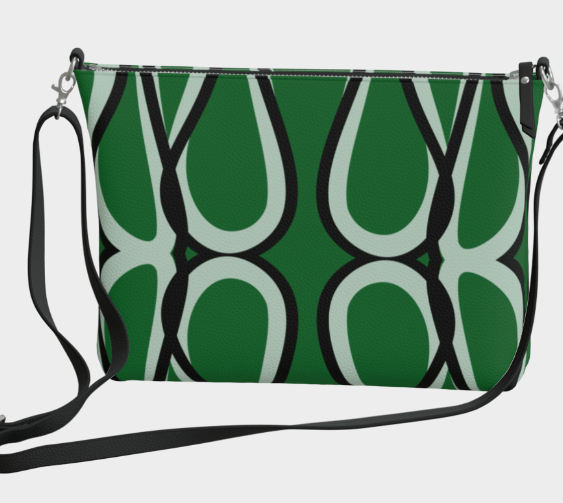 Green handbag with black abstract pattern on a light gray background