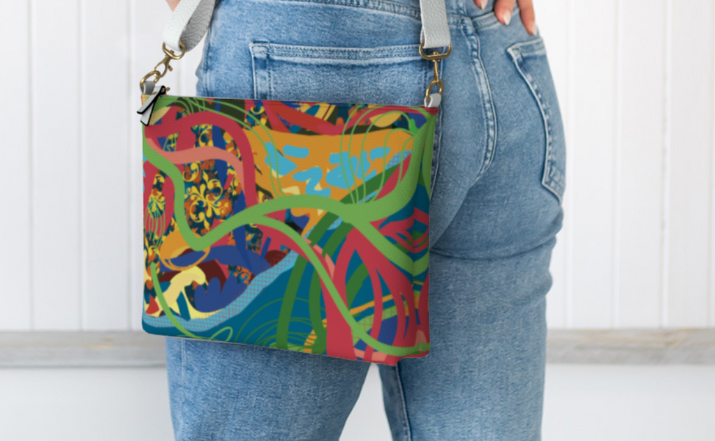 Person wearing a colorful patterned bag over their shoulder against a white background