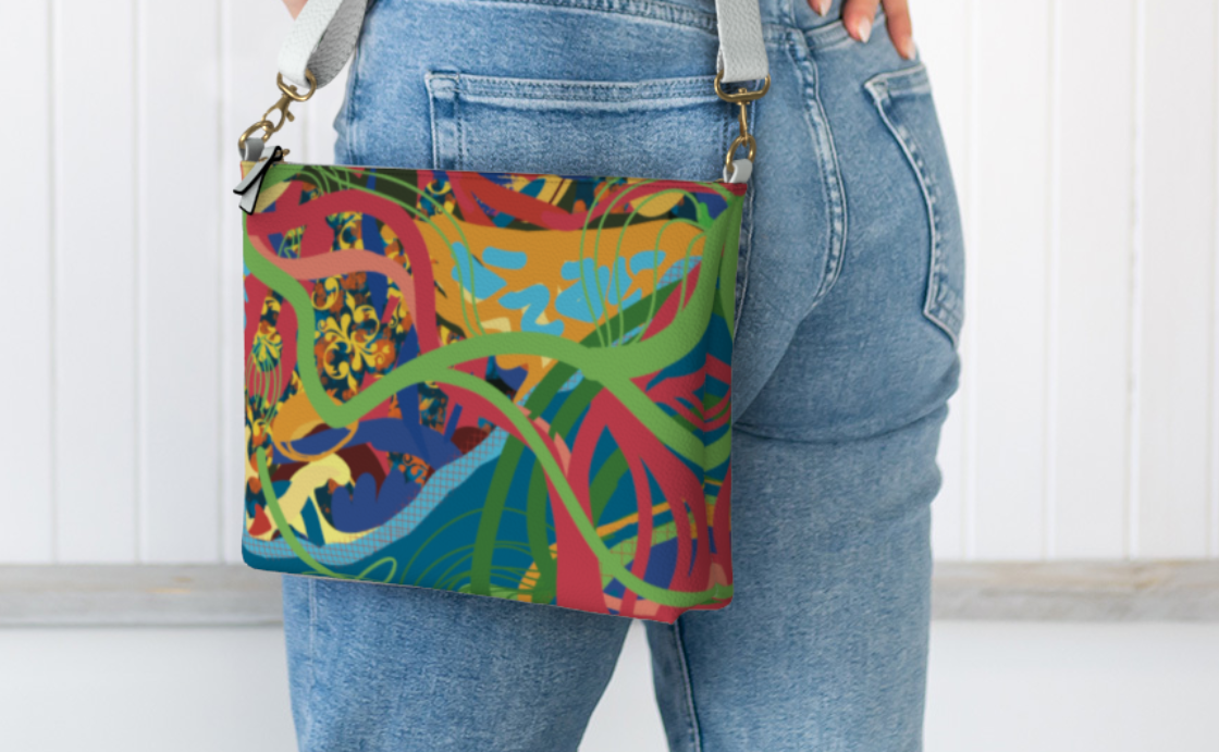 Person wearing a colorful patterned bag over their shoulder against a white background